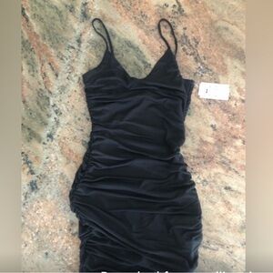 BRAND new/tags attached little black dress. XS